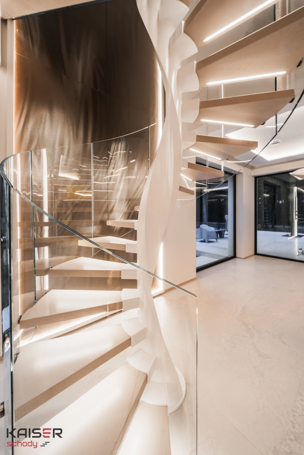 Light-coloured spiral staircase with a glass balustrade — view 01