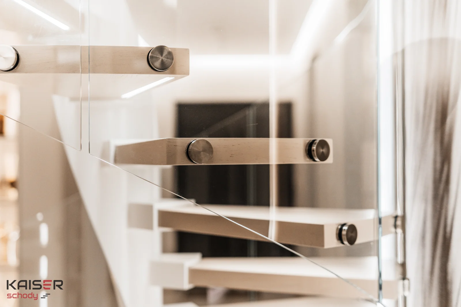 Light-coloured spiral staircase with a glass balustrade — view 05