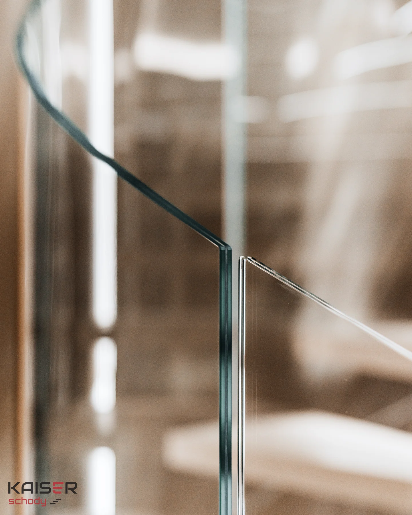 Light-coloured spiral staircase with a glass balustrade — view 06