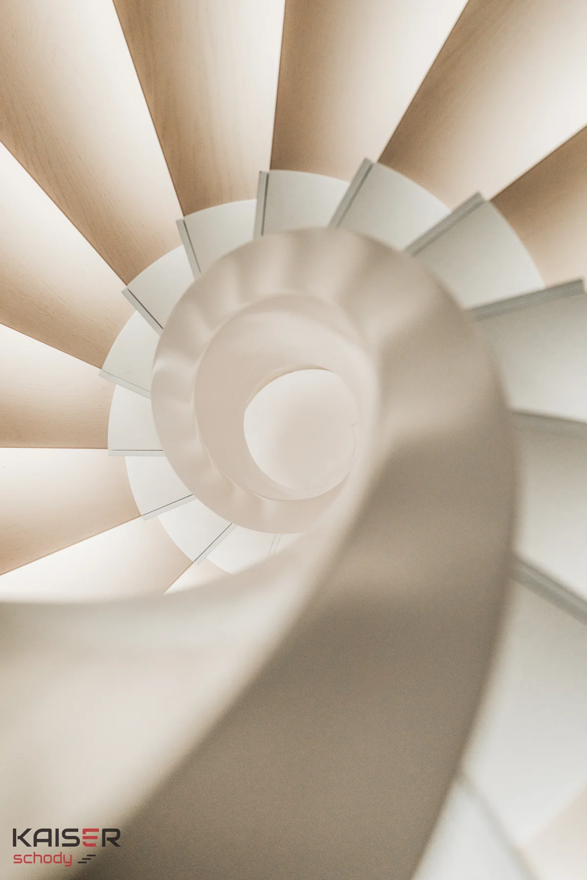 Light-coloured spiral staircase with a glass balustrade — view 07