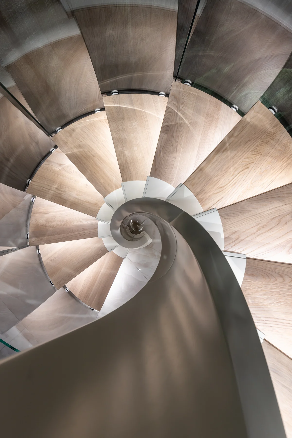 Spiral staircase with timber and curved glass — view 06